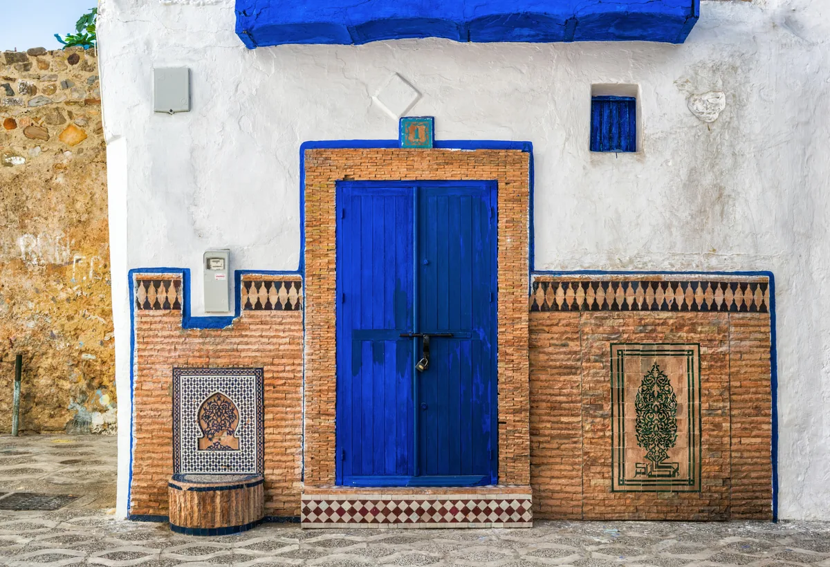 Blue Moroccan doorway with traditional tilework